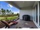 A covered patio with brick pavers, outdoor furniture, and a grill offers a perfect space for relaxing and entertaining at 4793 Antrim Dr, Sarasota, FL 34240