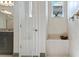 Bright and open tile shower with glass door, a rain shower head, and a built-in bench at 4793 Antrim Dr, Sarasota, FL 34240