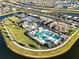 Stunning aerial view of community amenities, showcasing the pool, tennis courts, and lush landscaping at 5074 Surfside Cir, Bradenton, FL 34211