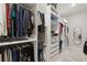 Walk-in closet with custom shelving and ample storage space for an organized wardrobe at 5074 Surfside Cir, Bradenton, FL 34211