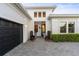 Front entrance featuring a paved walkway and beautiful plantings at 5074 Surfside Cir, Bradenton, FL 34211
