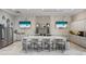Spacious kitchen area with marble countertops, modern appliances, and ample seating for residents at 5074 Surfside Cir, Bradenton, FL 34211