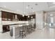 Stylish kitchen with dark cabinetry, stainless steel appliances, granite countertops, and a breakfast bar at 5074 Surfside Cir, Bradenton, FL 34211