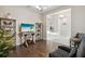 Cozy living room features hardwood floors, modern decor and an opening to the next room at 5074 Surfside Cir, Bradenton, FL 34211