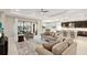 Spacious living room seamlessly connects to the kitchen and dining area, featuring a view of the outdoors at 5074 Surfside Cir, Bradenton, FL 34211