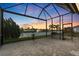 Screened patio overlooking a serene lake with fountain, offering stunning views and outdoor living at 5074 Surfside Cir, Bradenton, FL 34211