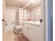 Well-lit bathroom featuring a tub/shower, toilet, and a vanity with ample counter space at 5122 Northridge Rd # 110, Sarasota, FL 34238