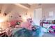 Whimsical bedroom featuring cheerful decor, plush bedding, and playful accents at 5122 Northridge Rd # 110, Sarasota, FL 34238
