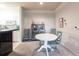Cozy dining area features a round table with seating for four and a decorative display cabinet at 5122 Northridge Rd # 110, Sarasota, FL 34238