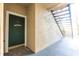 Close-up of an entryway showcasing a door with a welcome sign and nearby stairs at 5122 Northridge Rd # 110, Sarasota, FL 34238