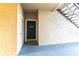 Front door view with door number 110, showcasing a secure entrance and a welcome sign at 5122 Northridge Rd # 110, Sarasota, FL 34238