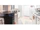 Bright kitchen with modern appliances, a breakfast bar and plenty of counter space at 5122 Northridge Rd # 110, Sarasota, FL 34238