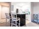Modern kitchen featuring a breakfast bar with seating and stylish countertops at 5122 Northridge Rd # 110, Sarasota, FL 34238