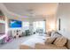 Bright living room with a large comfortable sofa and a sliding glass door leading to an outdoor patio at 5122 Northridge Rd # 110, Sarasota, FL 34238