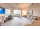 Cozy living room with plush seating and a sliding glass door providing natural light at 5122 Northridge Rd # 110, Sarasota, FL 34238