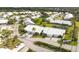Aerial view of Crestwood Villas shows the community layout with mature trees at 5320 Crestlake Blvd # 26, Sarasota, FL 34233