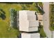 Aerial view of the home showing roof and surrounding lush landscaping at 5320 Crestlake Blvd # 26, Sarasota, FL 34233