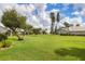 Expansive, well-maintained lawn offers plenty of space for outdoor activities in this beautiful backyard at 5320 Crestlake Blvd # 26, Sarasota, FL 34233