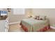 Cozy bedroom with hardwood floors, soft lighting, and a comfortable queen-sized bed with stylish decor at 5320 Crestlake Blvd # 26, Sarasota, FL 34233