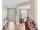 Inviting entryway with decorative glass door, leading to a bright living space and stylish, comfortable furniture at 5320 Crestlake Blvd # 26, Sarasota, FL 34233