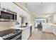 Eat-in kitchen with modern white cabinetry, stainless steel appliances, and seamless flow to living areas at 5320 Crestlake Blvd # 26, Sarasota, FL 34233