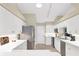 Bright kitchen with white cabinets, stainless steel appliances, and ample counter space for easy meal prep at 5320 Crestlake Blvd # 26, Sarasota, FL 34233