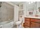 Well-lit bathroom featuring a shower/tub combo and a vanity with granite countertops at 5710 Palmer Cir # 105, Bradenton, FL 34211