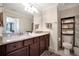Bathroom featuring a double sink vanity with granite countertops and modern fixtures at 5710 Palmer Cir # 105, Bradenton, FL 34211