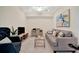 Inviting living room featuring a comfortable sofa, accent chair, and a convenient workspace at 5710 Palmer Cir # 105, Bradenton, FL 34211