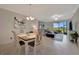 Open-plan living and dining area with sliding glass doors that provide lots of natural light and scenic views at 5710 Palmer Cir # 105, Bradenton, FL 34211