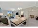 Open concept with views of the dining area, lanai, and backyard through sliding glass doors at 5710 Palmer Cir # 105, Bradenton, FL 34211