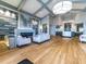 Lobby area with a fireplace, modern sofas, light wood flooring, and contemporary lighting fixtures at 5710 Palmer Cir # 105, Bradenton, FL 34211