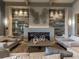 Spacious lobby featuring a modern fireplace, neutral furniture, and stylish decor at 5710 Palmer Cir # 105, Bradenton, FL 34211