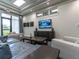 Comfortable lounge area with modern furnishings, a flat-screen TV, and stylish decor at 5710 Palmer Cir # 105, Bradenton, FL 34211
