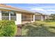 Enclosed screened lanai offers an outdoor living space with a fan and views of the manicured lawn at 5907 Guarino Dr, Sarasota, FL 34238