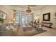 Cozy living room with a decorative rug, French doors, and a view of the pool at 7028 Lacantera Cir, Lakewood Ranch, FL 34202