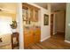 A stylish bar area featuring glass-front cabinets with bottles, perfect for entertaining at 7113 91St E St, Palmetto, FL 34221