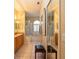 Spacious bathroom with a double vanity, walk-in shower, soaking tub, and tile floors at 7113 91St E St, Palmetto, FL 34221