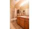 Well-maintained bathroom with neutral tile and vanity storage at 7113 91St E St, Palmetto, FL 34221
