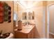 Bathroom offers a spacious countertop, vanity and large mirror at 7113 91St E St, Palmetto, FL 34221
