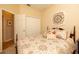 Cozy bedroom features a closet, carpet floors, and a queen bed with decorative pillows at 7113 91St E St, Palmetto, FL 34221