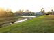 Picturesque view of community's green space with tranquil pond, perfect for nature lovers and community enjoyment at 7113 91St E St, Palmetto, FL 34221