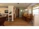 Open-concept dining room with hardwood floors, elegant chandelier, and a cozy atmosphere at 7113 91St E St, Palmetto, FL 34221