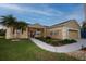 Beautiful exterior showcasing manicured lawn, decorative elements, and an attached two-car garage at 7113 91St E St, Palmetto, FL 34221
