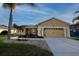 Charming single-story home features a well-manicured lawn, a two car garage and a welcoming front entrance at 7113 91St E St, Palmetto, FL 34221