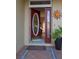 Open front door view into the house, showcasing the beautiful entry and a glimpse of the living area at 7113 91St E St, Palmetto, FL 34221