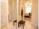 Hallway with mirrored closets leading to a bedroom with ceiling fan at 7113 91St E St, Palmetto, FL 34221