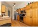 Well-lit kitchen with stainless steel appliances, wood cabinets, and ample counter space for cooking at 7113 91St E St, Palmetto, FL 34221
