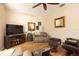 Comfortable living room with wood floors and a large TV, perfect for relaxing at 7113 91St E St, Palmetto, FL 34221