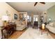 Cozy living room with an open layout, comfortable seating, and a view of the dining area at 7113 91St E St, Palmetto, FL 34221